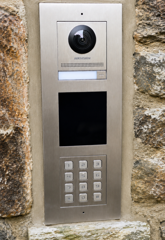 Stone wall with intercom panel