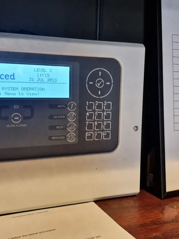 Advanced fire alarm control panel labeled TechSmart.