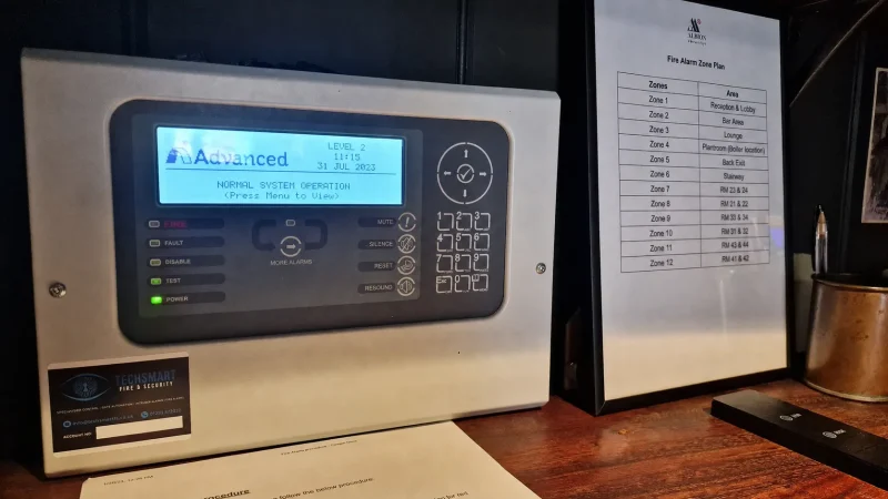Advanced fire alarm control panel labeled TechSmart.