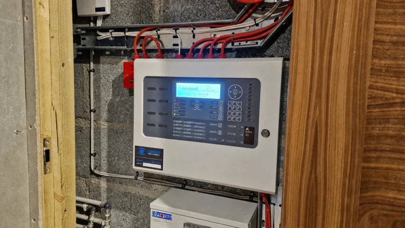 Advanced MixPro fire alarm control panel mounted on a wall.