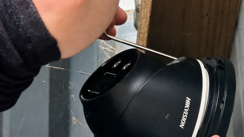Hikvision dome-style CCTV camera installed on a surface.