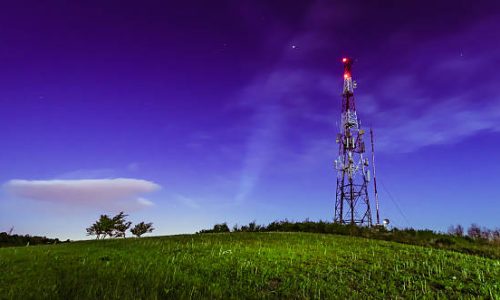 Night shot of the antenna tower on the top of the hill